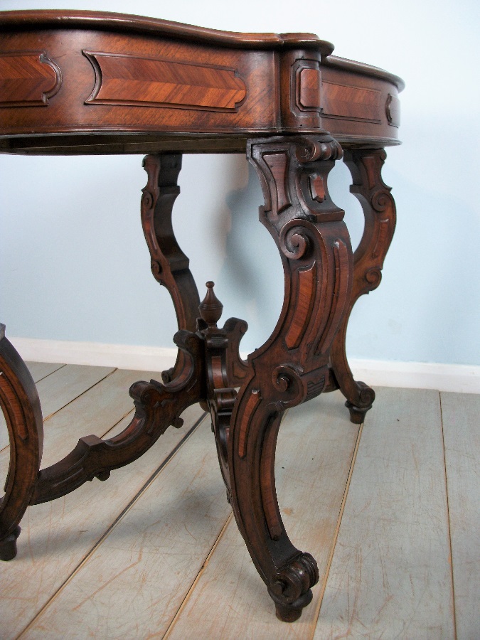 Antique Italian Occasional Table with profusely carved and shaped legs 